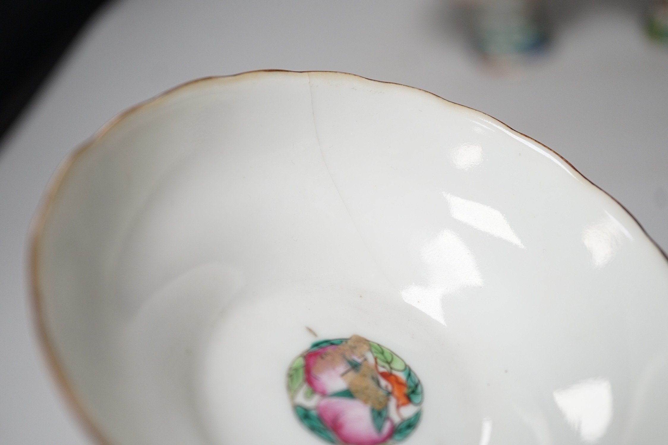 Three 19th century Chinese stem cups, painted with insects, flowers, bats and peaches, largest 9cm